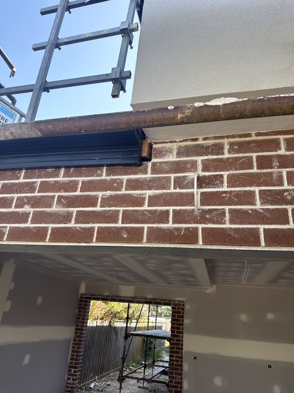 Timber frame left exposed between the brickwork and the fascia, Berwick
