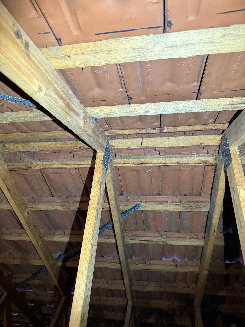 Roof bracing over the entry not bent over and nailed off as required, Berwick