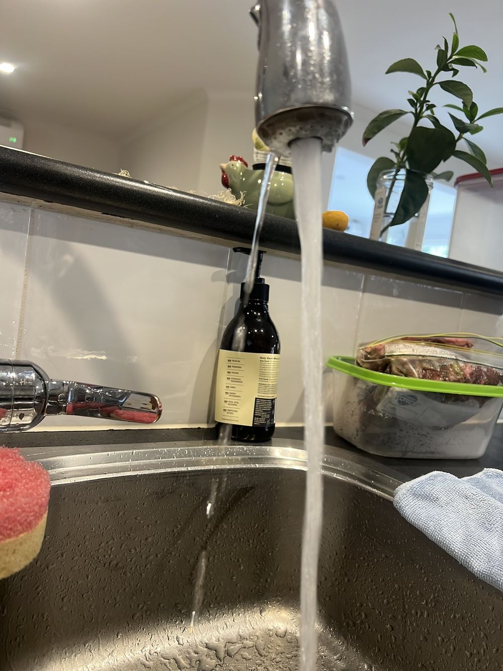 Kitchen tap leaking from the faucet head while running, found during a pre-purchase inspection in Berwick