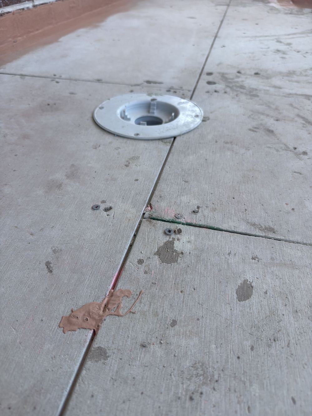 Balcony puddle flange sitting proud instead of set into the floor sheet, found during a waterproofing inspection in Berwick